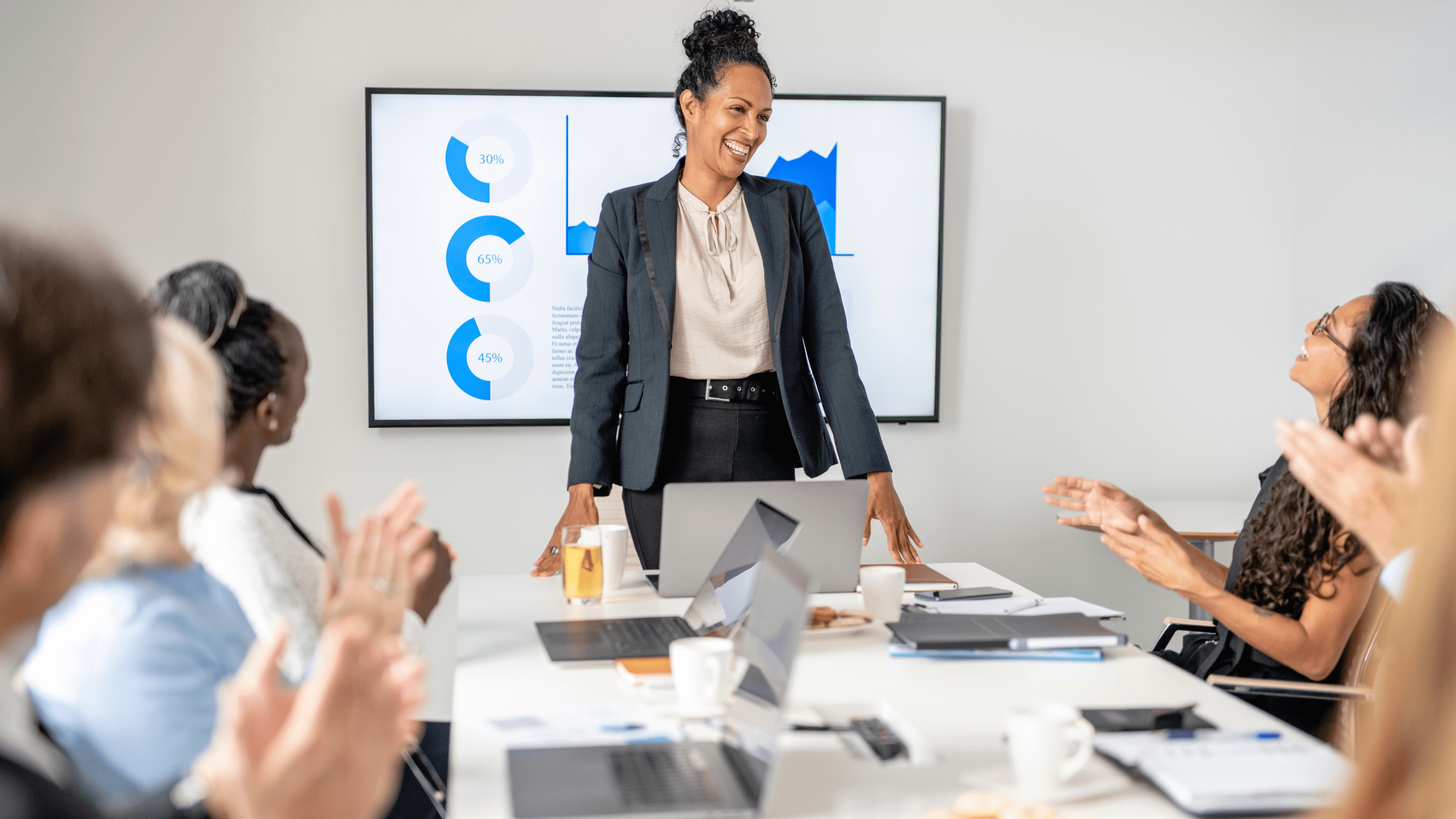 Executive woman at the head of a meeting